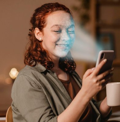 Woman with phone doing face scan &mdash; face-box hero